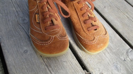 Vintage brown suede Cougar brand shoes.